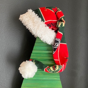 NHL Minnesota Wild block print fleece with white furry fleece trim and 3 inch pom pom