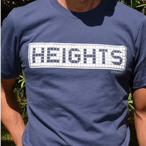 May include: A navy blue t-shirt with a white pixelated design that reads "HEIGHTS" with the text "Co.Kustom" in smaller white letters below the design.