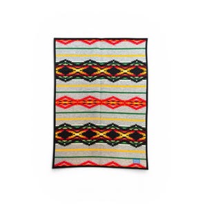 May include: A white ceramic mug with a black handle and the text "But First, Coffee" in a bold, black font. The mug is set against a neutral background, highlighting its simple design.