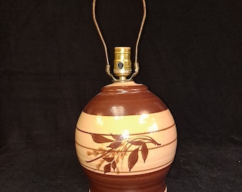 VTG  Earthenware Lamp from the 1970s , soothing Brown and tan tones stylized wheat motif. 12 inch to top of socket 8 inches wide . rewired.