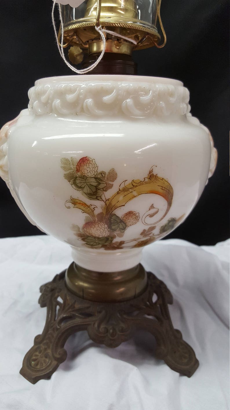 antique oil lamp with applied decoration iron stand hurricane lamp Molded Milk glass oil font Consolidated Glass Company pink