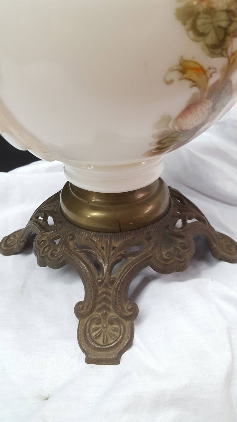 antique oil lamp with applied decoration iron stand hurricane lamp Molded Milk glass oil font Consolidated Glass Company pink