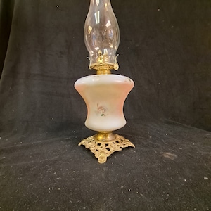 Milk Glass Hand Painted Oil lamp  with hand painted blue florals unusual cinched shaped font  with cast iron decorative base , no chips