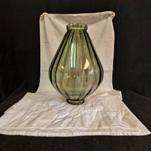 Gray smoked glass swag lamp body with   optic ribbed pattern 15 inches tall , 11 inch diameter widest point , top and bottom opening .