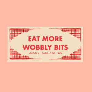 May include: A beige rectangle with a red border and the text "EAT MORE WOBBLY BITS" in red. The text "OFFALY GOOD FOR YOU" is also in red and smaller font.