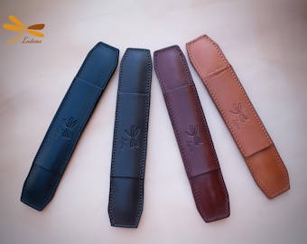 Protective padded leather straps for bag or backpack.