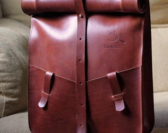 Premium leather roll-top backpack for MacBook pro 15, adjustable handmade design.