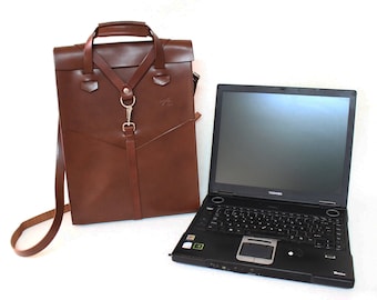 leather laptop bag. Handbag with removable shoulder strap and front pockets. Designed by Ludena.