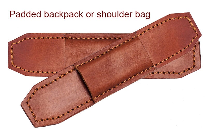 Protective padded leather straps for bag or backpack.