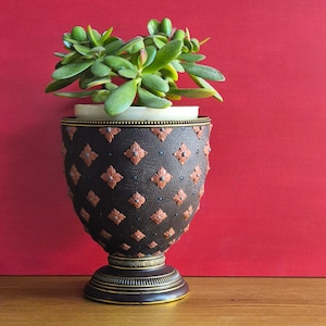 May include: A handmade wooden chopping board with a natural finish. The board has a live edge on one side and a smooth, rectangular shape. It is approximately 45 cm long and 30 cm wide.