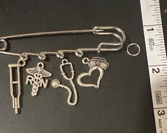 Nurse RN Safety Pin Charm  Brooch Pin ,  Stethoscope, Cap on Heart, RN Symbol, Crutch  Silver Metal