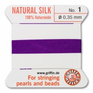 May include: A spool of purple natural silk thread, labeled "NATURAL SILK" and "No. 1". The thread is 0.35 mm in diameter. The label also includes the website www.griffin.de and the text "For stringing pearls and beads."