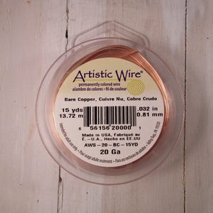 May include: A spool of Artistic Wire in bare copper. The package indicates 15 yards (13.72 m) of .032 in (0.81 mm) wire. The label also includes the text "permanently colored wire" and "20 Ga".