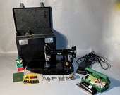 1949 Singer Featherweight w Buttonholer 7 Attachments, Accessories And Case Works Great Shipping is NOT included. Ask for a quote.