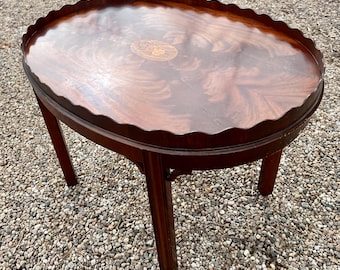 Councill Coffee Table Piecrust With Inlaid Medallion Flame Mahogany *Shipping is NOT free. Ask for cost to ship.*