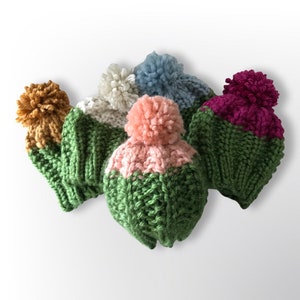 May include: Five knitted hats with pom-poms in various colors, including green, pink, blue, white, and burgundy. The hats are all made with a chunky yarn and have a simple, classic design.