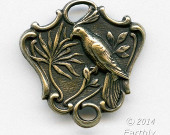 Oxidized brass 2 ring connector depicting a bird on a branch. 20x20mm. Pkg. of 2. B9-2301