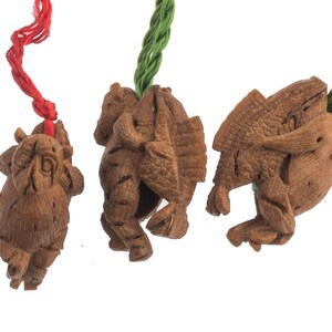 Vintage fruit pit carvings of monkey carrying fish on back.  Set of 3.  B7-wo340