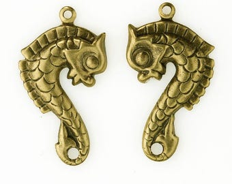 Antique finish gold plated brass medieval stamped sea horse charms. 30x16mm. Sold as 1 facing pair. b9-2384