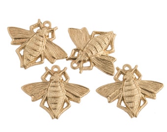 May include: Four gold-colored metal bee charms with intricate details. Each charm has a loop for attaching to a necklace, bracelet, or other jewelry.
