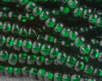 Vintage Italian two-tone seed beads. Light lavender glass with emerald green foil core. Size 10. 10 gram bag. b17-233