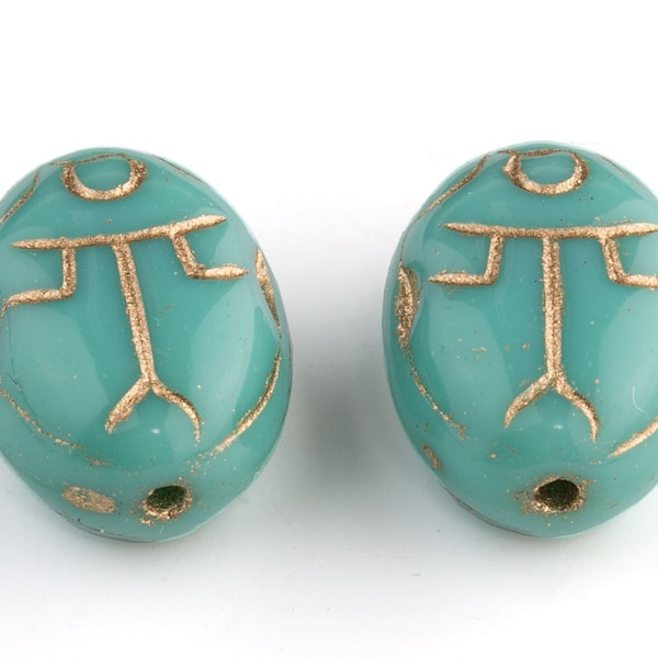 Czech pressed turquoise glass scarab bead with gold decor. 14x10x7mm. Pkg 4. b11-bl-2136