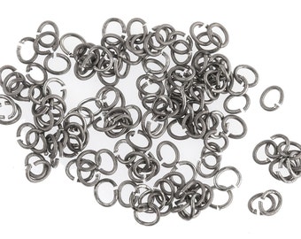 Vintage Oxidized silver plated 22 gauge 3.5mm oval open jump rings. Pkg 100.  b9-2470