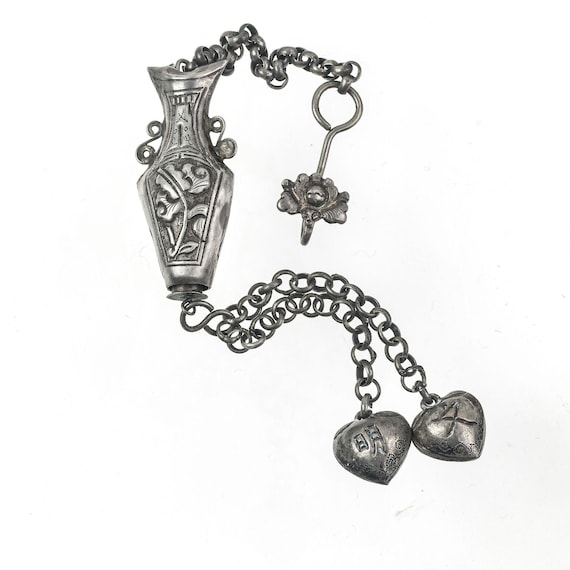 Antique Chinese Qing Dynasty silver repoussé needle case with charms and chatelaine clip. pdvs2009