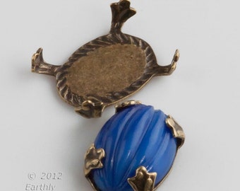 Platt baksida i oxiderad mässing med 4 stift för sköldpaddsfattring, 14 x 10 mm oval. Paket med 4 st. b9-2237