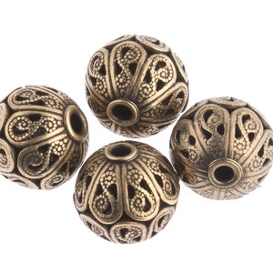 superb quality solid brass filigree bead. 10x11mm. Pkg of 1. b18-0135