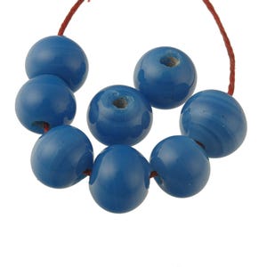 Chinese opaque blue wound glass beads 12mm Pkg 4. b11-bl-2156