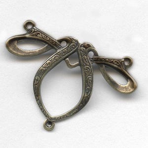 Art Nouveau style oxidized brass pendant. 22x30mm Pkg. of 1. b9-0844