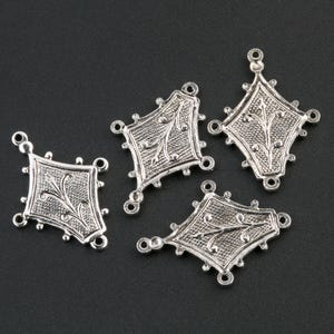 Silver plated brass 4 ring stamping, 20 x 15mm. Pkg 4. b9-0849s