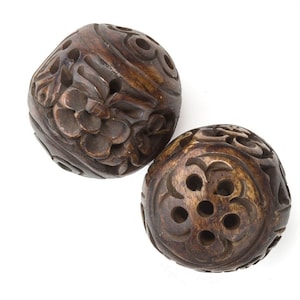 Carved, pierced and stained hollow bone beads. 24MM. Sold individually. b3-bo183