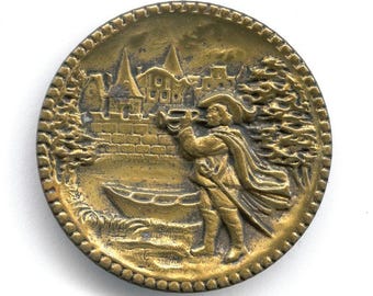 Antique stamped brass large picture button. Village Herald with Trumpet 1.5 inches. bt-vc268