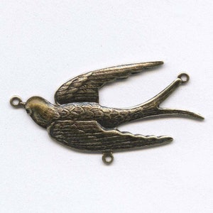 May include: Antique brass swallow charm with two jump rings for attaching to jewellery or crafts.