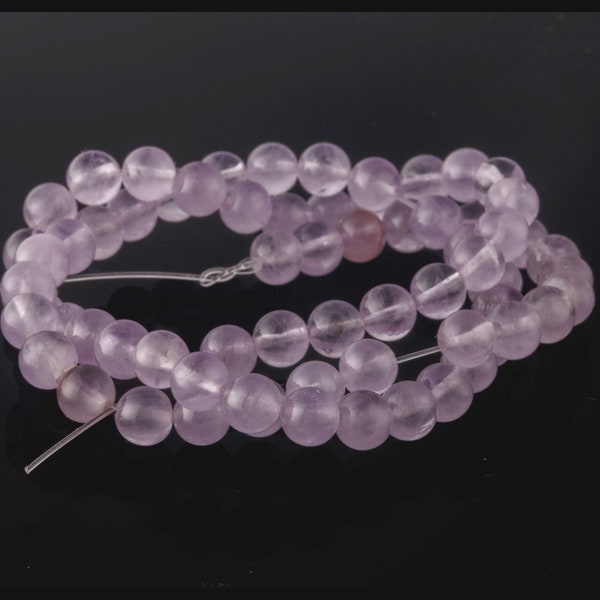 Old stock natural light lavender amethyst 6mm smooth clear round beads.16 inch strand. b4-ame228
