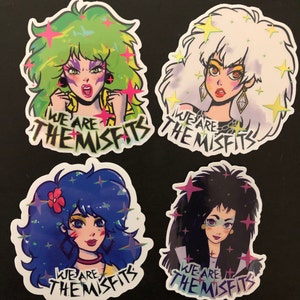 May include: Four colorful stickers featuring cartoon characters with the text "We are the Misfits" on each. The characters have green, white, blue, and black hair and are wearing colorful outfits.