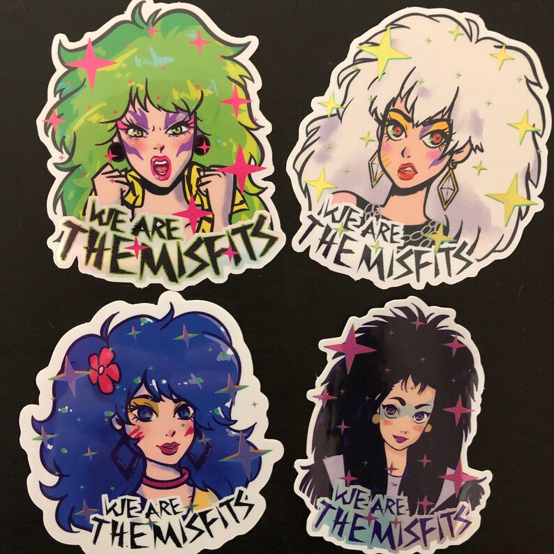 May include: Four colorful stickers featuring cartoon characters with the text "We are the Misfits" on each. The characters have green, white, blue, and black hair and are wearing colorful outfits.