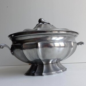 French fluted pewter tureen with lid with pear on leaves finial and French pewter stamp.