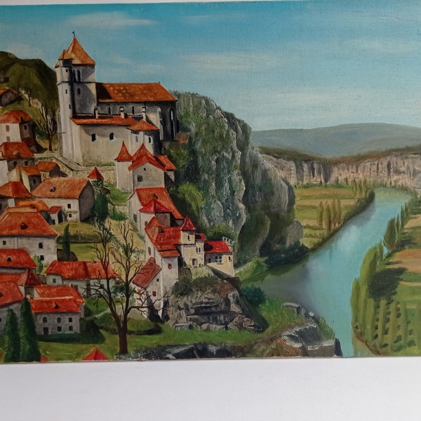 French vintage landscape of the hillside village of Saint-Cirq-Lapopie, oil on canvas painting circa mid century.