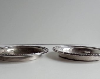 Pair of Ercuis silver plated coasters in very shabby chic condition bead design with makers stamp.