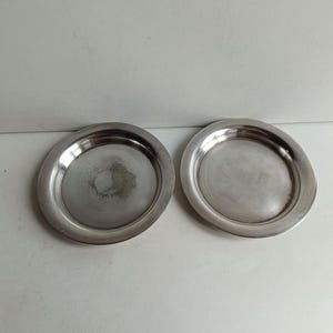 Pair of French antique Modernist Christofle (OC mark) shabby chic silver plated wine bottle coasters, circa 1930s.