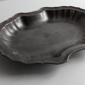 French vintage / antique pewter serving bowl with scallop design and slightly fluted edges.