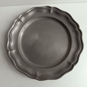 French vintage fluted pewter plate with pewter stamps.