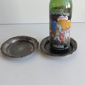 Pair of Large Christofle Gallia wine bottle coaster from the House of Christofle, Paris silversmiths, with fluted edges.