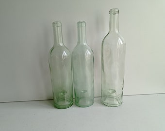 Only 3 now available: French antique blown glass wine bottles with deep pontil mark in the base circa early 1900s.