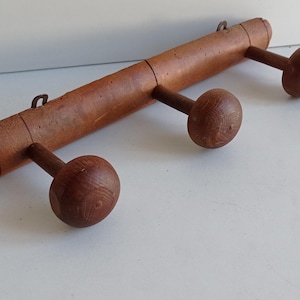 French antique modernist bamboo style 3 peg wood coat rack with original metal brackets circa 1920s.