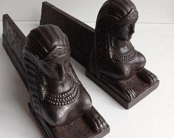 Heavy French antique Egyptian Sphinx bust on cast iron andirons / fire irons / fire dogs, circa early 1900s.