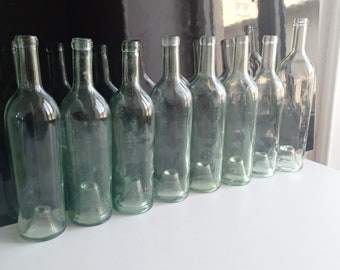 Only 3 now available: French antique blown glass wine bottles with deep pontil mark in the base circa early 1900s.